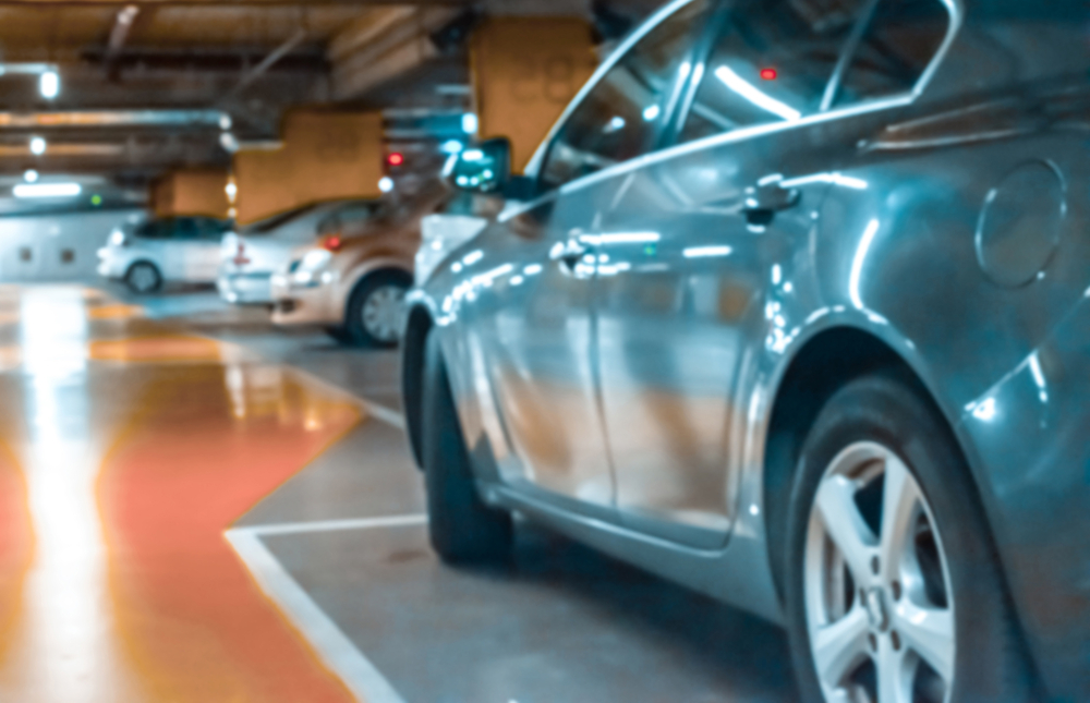 Parking,Car,Blurred.,Empty,Road,Asphalt,Background,In,Soft,Focus.